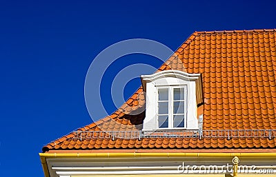 Tiled roof and one window Stock Photo