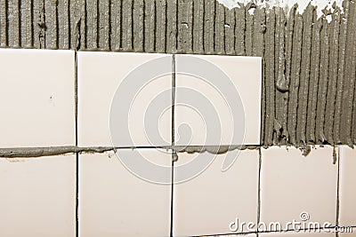 Tiled wall in process Stock Photo