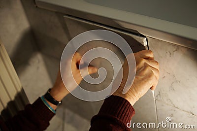 A tiler at work. Stock Photo