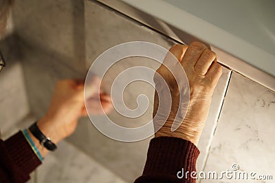 A tiler at work. Stock Photo