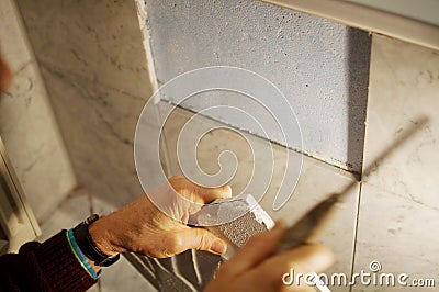 A tiler at work. Stock Photo