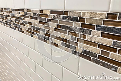 Tiles made of glass and stone installed on the wall as decoration or kitchen backsplash Stock Photo