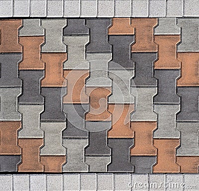 Tiles for outdoors and pavements, arranged transversely. Colors are orange,white and gray. Stock Photo