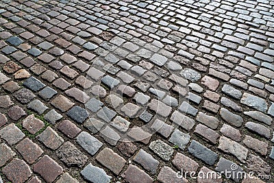 Tiles texture. Pattern of ancient german cobblestone in city downtown. Little granite paving stones. Antique gray pavements Stock Photo