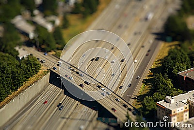 Tilt shift detail of bridge crossing interstate highway with cars Stock Photo