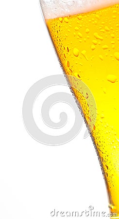 Tilted glass of fresh beer and drops on white Stock Photo