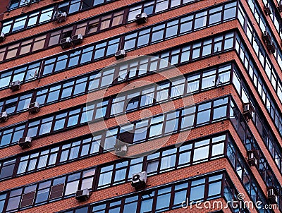 Tilted windows of many-storied building architecture backdrop Stock Photo