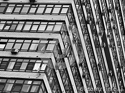 Tilted windows of many-storied building architecture backdrop Stock Photo