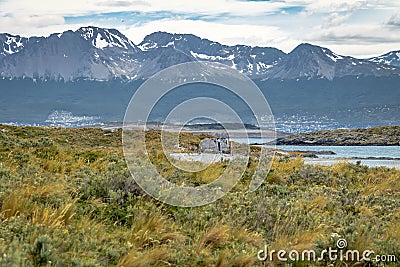 Timber house in Island and mountains view in Beagle Channel - Ushuaia, Tierra del Fuego, Argentina Stock Photo