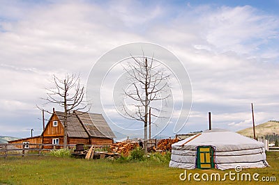 Timber house and Mongolian ger Stock Photo