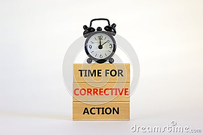 Time for corrective action symbol. Wooden blocks with words `Time for corrective action` on a beautiful white background. Black Stock Photo