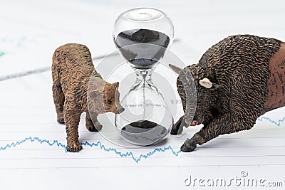 Time counting down to choose between investment bear and bull st Stock Photo