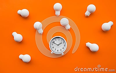 Time,dateline and creativity concepts with group of lightbulb and alarm clock on color background.Business solution.Performance of Stock Photo