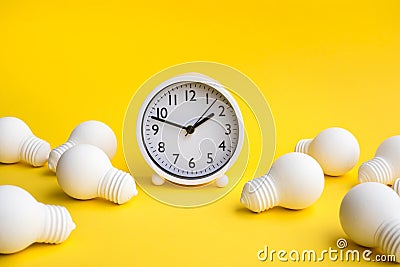 Time,dateline and creativity concepts with group of lightbulb and clock on pastel color background.Business solution.Performance Stock Photo