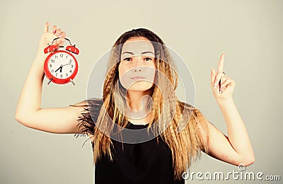 Time management. Woman hold vintage alarm clock. Watch repair. Punctuality and discipline. Practice of advancing clocks Stock Photo