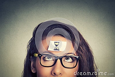 Time management. young woman with sand clock sign Stock Photo