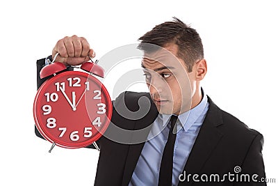 Time is money : businessman holding up red alarm clock isolated Stock Photo