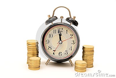 Time is Money concept with Coins stack around clock Stock Photo