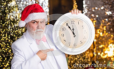 time for party. clock showing almost midnight. time to celebrate winter holidays. hurry up. Christmas countdown arriving Stock Photo
