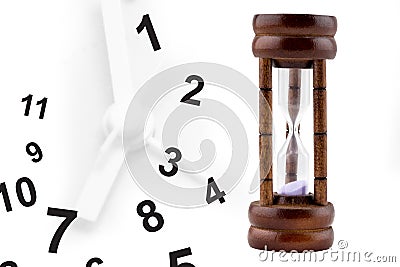 Time running out: sand falling inside hourglass Stock Photo