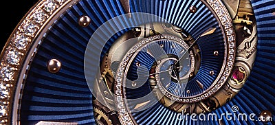 Time spiral clock concept. Round blue diamond golden clock with hands twisted to surreal spiral. Abstract watch background with tw Stock Photo