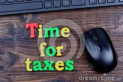 Time for taxes words on table Stock Photo