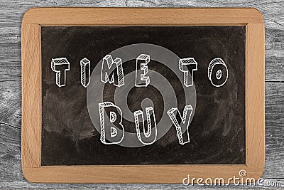 Time to buy - chalkboard with outlined text Stock Photo