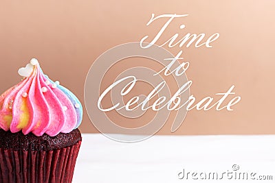 Time to Celebrate, Cute little white heart on rainbow cream cupcake, sweet dessert concept, close up Stock Photo