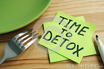 Time to detox concept. Fork and green plate Stock Photo
