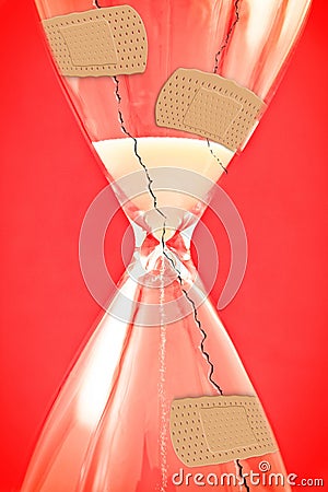 Time to heal - concept image with cracked hourglass and bandaid on red background Stock Photo