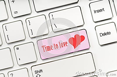 Time to love pink key button on white keyboard concept Stock Photo