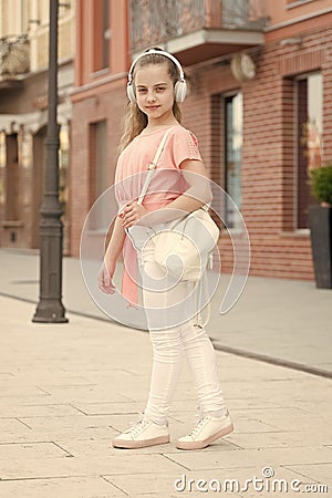 Time to move your body. Summer vacation and tourism. Girl carefree child with headphones listening music. Summer music Stock Photo