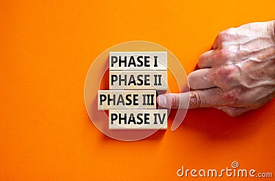 Time to phase 3. Wooden blocks form the words `phase, 1, 2, 3, 4` on orange background. Male hand. Beautiful background. Busines Stock Photo