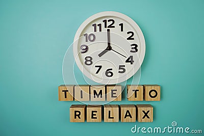 Time To Relax alphabet letter with alarm clock on blue background Stock Photo