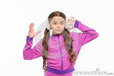 Time to rest. Active girl enjoy music playing in earphones. Athletic little girl relaxing isolated on white. Cute girl Stock Photo