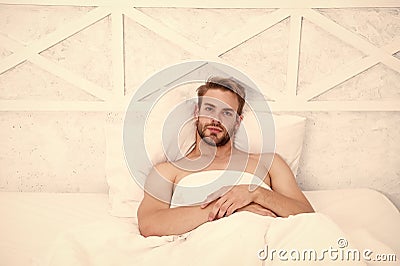 Time to rest. morning erection concept. asleep and awake. Relaxing in bedroom. energy and tiredness. sexy man in bed Stock Photo