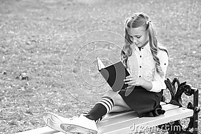 Time to study. Studying in school yard. Smart schoolgirl. Student adorable child in formal uniform relaxing outdoors Stock Photo