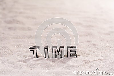 Time word on white sand Stock Photo