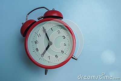 timeliness concept of red round clock at 8 o`clock Stock Photo