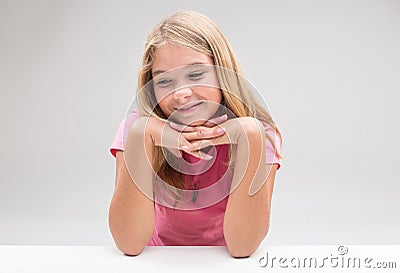 Timid girl daydreaaming or thinking positive Stock Photo