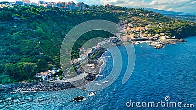 Timpa di Acireale aerial view from above on Santa Maria la Scala with sea and blue sky Stock Photo