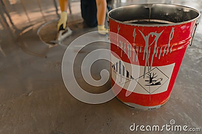 Tin bucket with toxic composition and epoxy resin inside Stock Photo