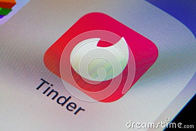 Tinder app on a smartphone. Dating app Editorial Stock Photo