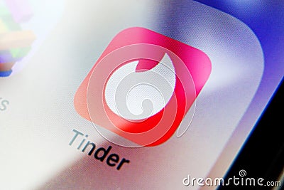 Tinder app on a smartphone. Dating app Editorial Stock Photo