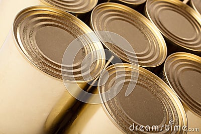 Tinned food. Row of metal cans with no label Stock Photo