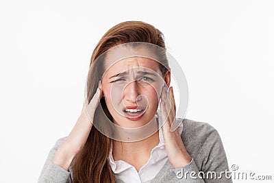 Tinnitus concept , 20s woman suffering from noise or having jaw ache Stock Photo