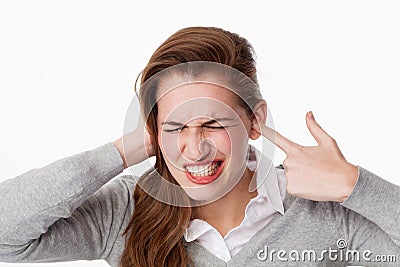 Tinnitus concept, 20s woman teeth grinding for noise or tinnitus problems Stock Photo