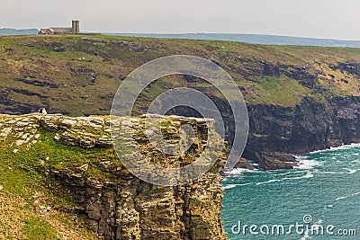 View of Tintagel Island and St Materiana`s church in the background. Editorial Stock Photo