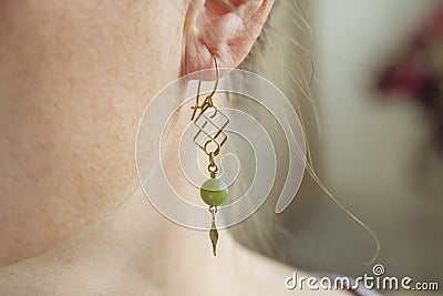 tiny elegant metal wire stone bead earring Stock Photo