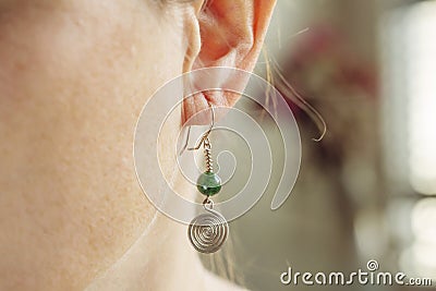 tiny elegant metal wire stone bead earring Stock Photo